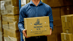 Man carrying box of Nordic Ice products