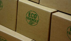 Eco friendly stamp printed on cardboard box. Ecology, organic, natural, life style and healthy diet concept.